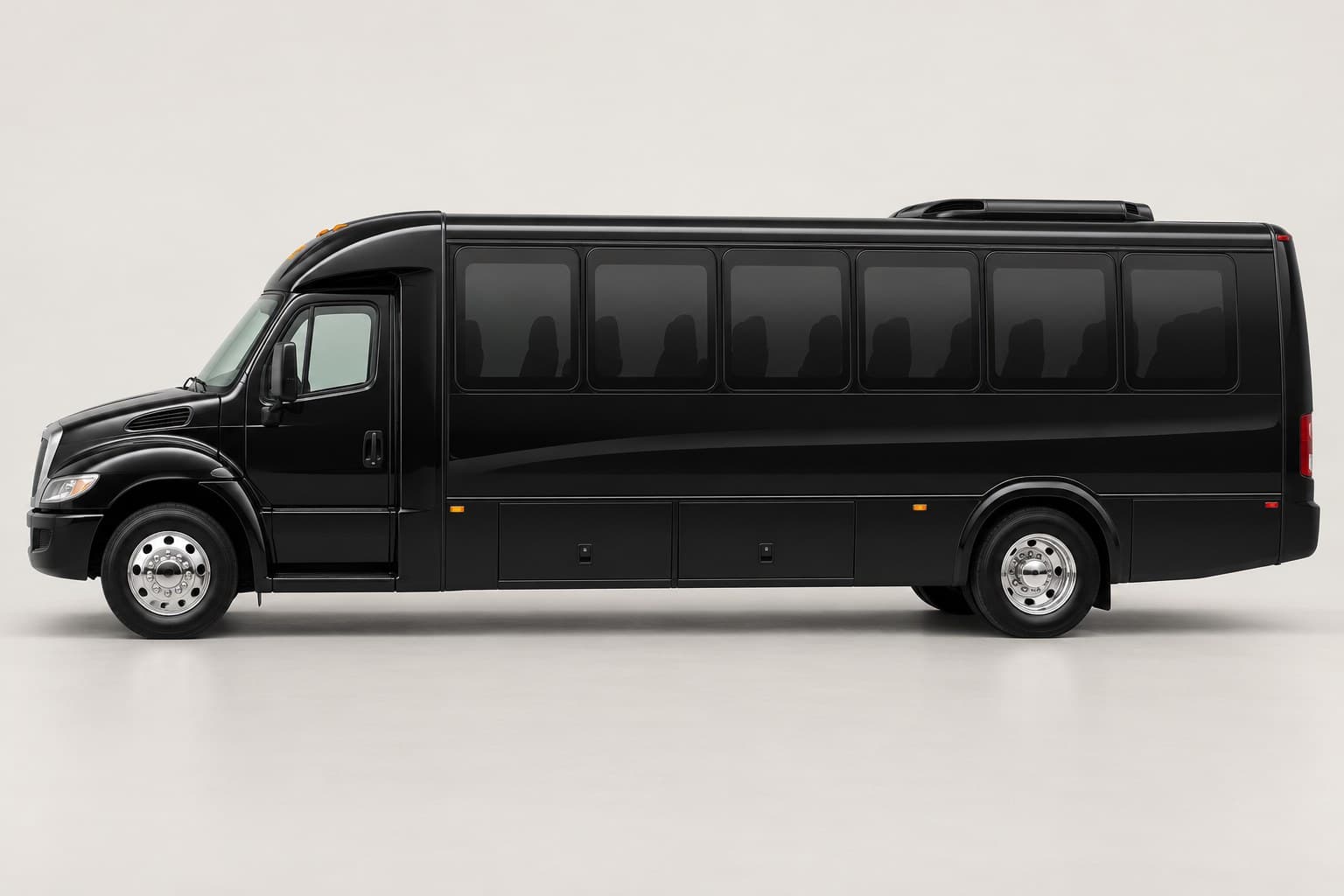 Illustrative black executive mini bus with a short hood in side profile on a neutral studio background